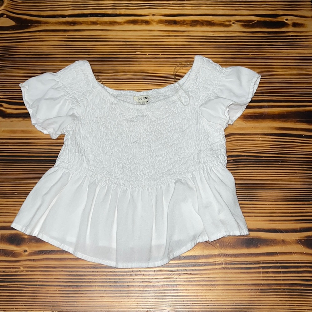 white cropped off the shoulder shirt